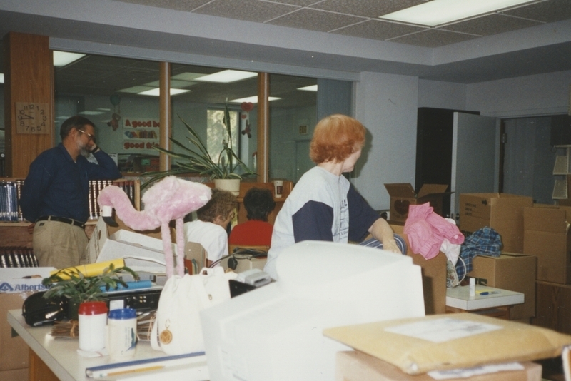 Library workers view the boxes as they pack for the move into the newly built Cherry Lane Library Building. 