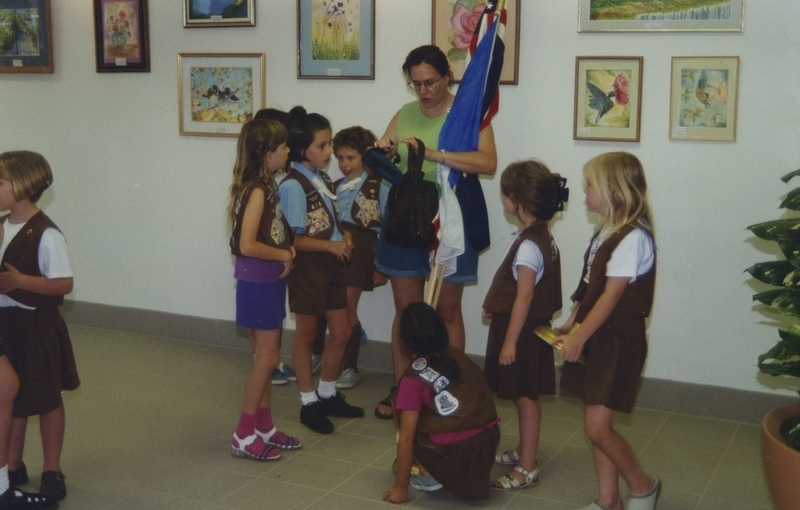 Photo of Brownies from Troop number 547 (under leadership of Tracy Curran) and 479 (under the leadership of Leslie Pugmire) gather together to prepare for the flag ceremony. 