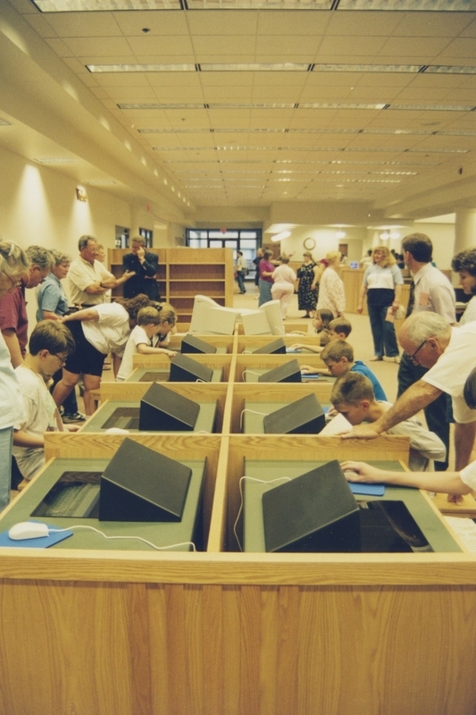 Patrons use the computers at the new Cherry Lane Library's open house. 