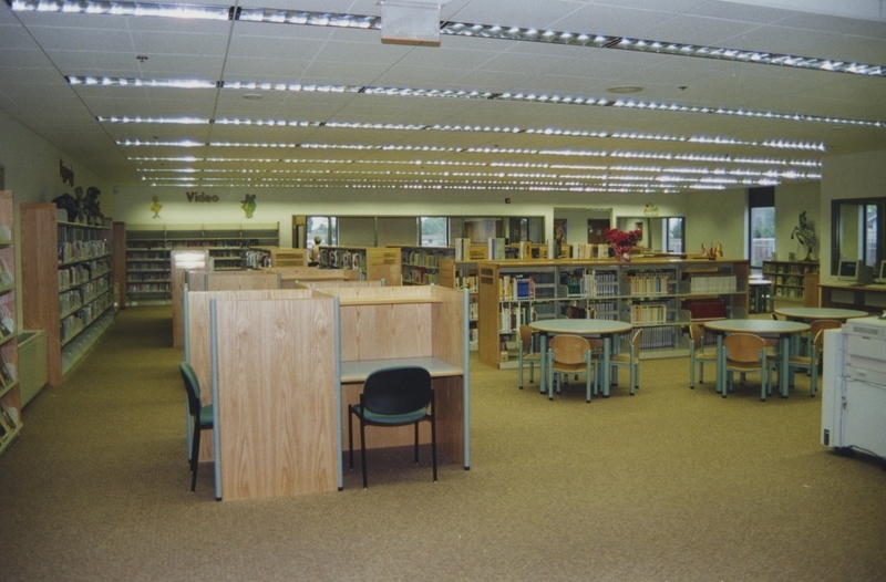 Study carrels, shelves, and tables in the Cherry Lane Library Children's section. 