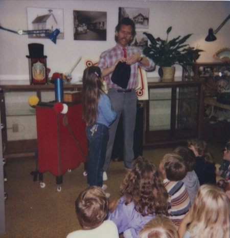 The Great Moodini performs his magic act with the help of audience member Angie.