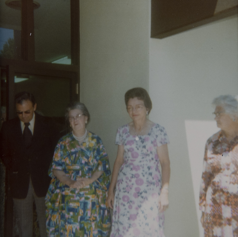 Color photo of the re-opening of the newly enlarged library. From left to right: Mayor Don Storey, Librarian Nancy Sage, and Occident Club President Mildred Langley