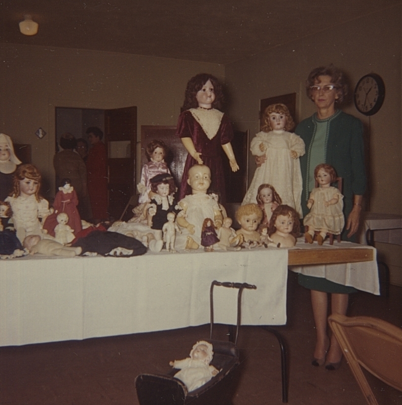 For the February 1965 club meeting, Mrs. Lee Dornbecker shows a portion of her doll collection 