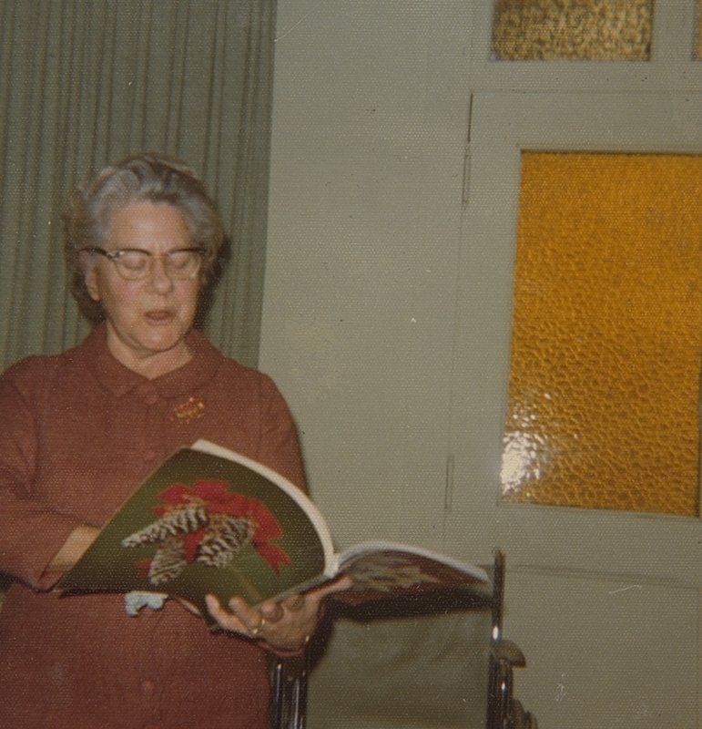 Bernice Booth reads an inspiration from Ideals at Club Meeting