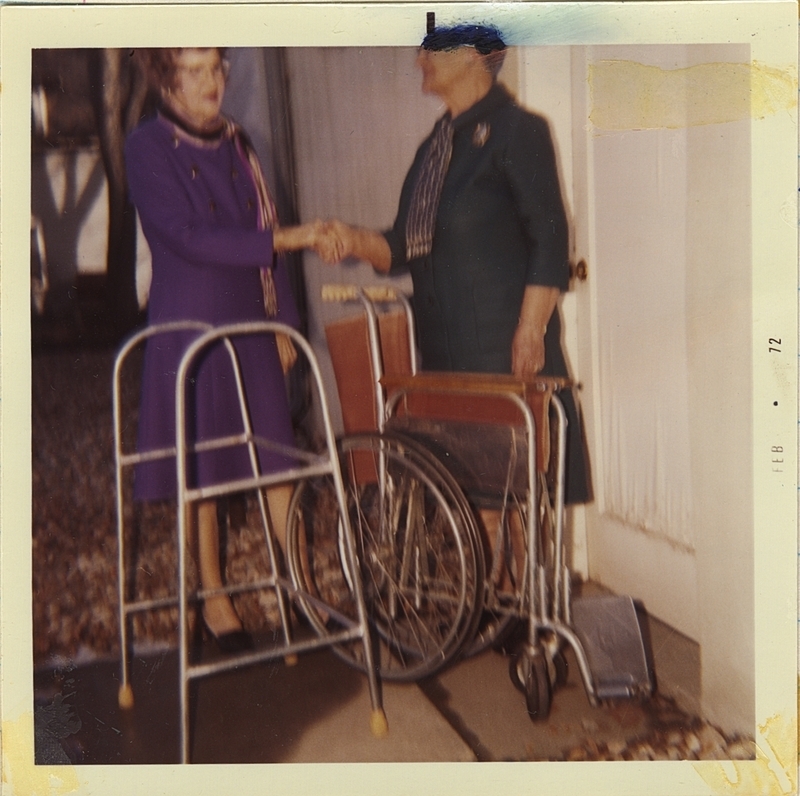 Ethel Heiker returns Emergency Loan Equipment to Zelma Haworth of the Emergency Loan Committee