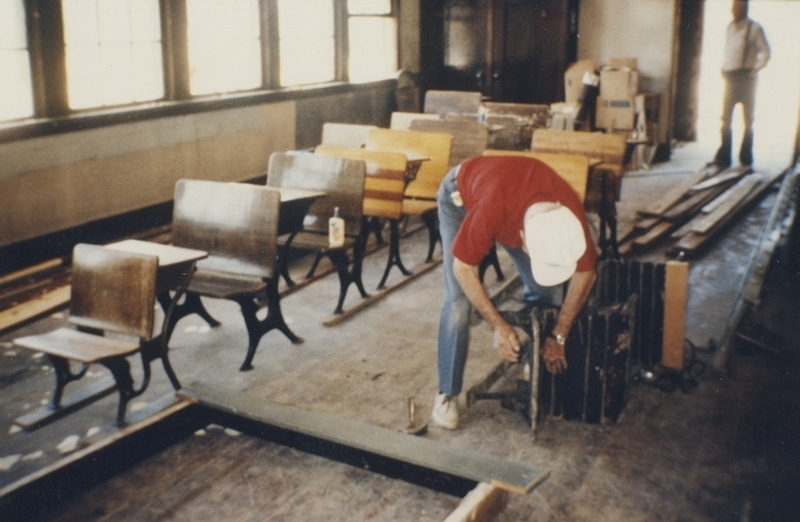 Art Hall repairing old desks for the Pine Street School renovation, 1993