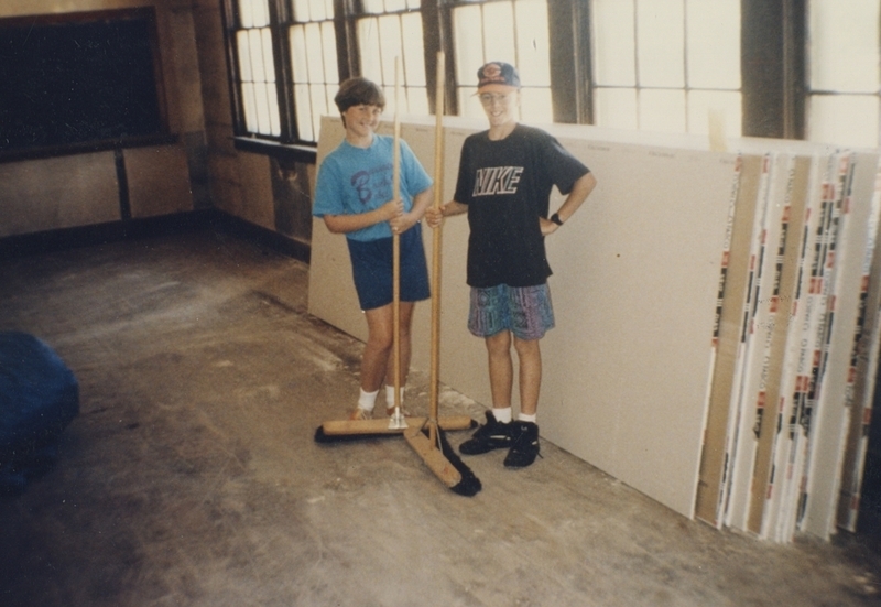 Katie Rutan and Derek Alger help Doug Rutan clean the inside of the Pine Street School during renovation, 1993