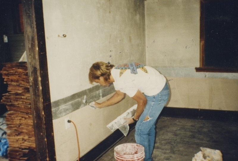 Connie Dalling patches the walls during the Pine Street School renovation, 1993