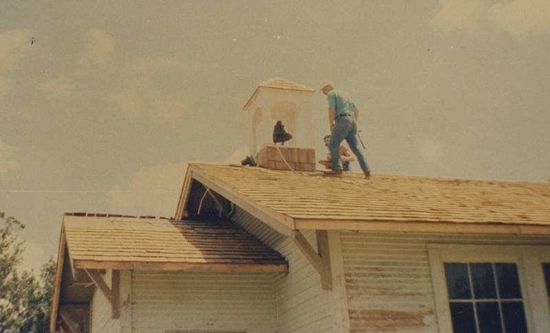 Brent Alger shingles the bell tower during the Pine Street School renovation, 1993