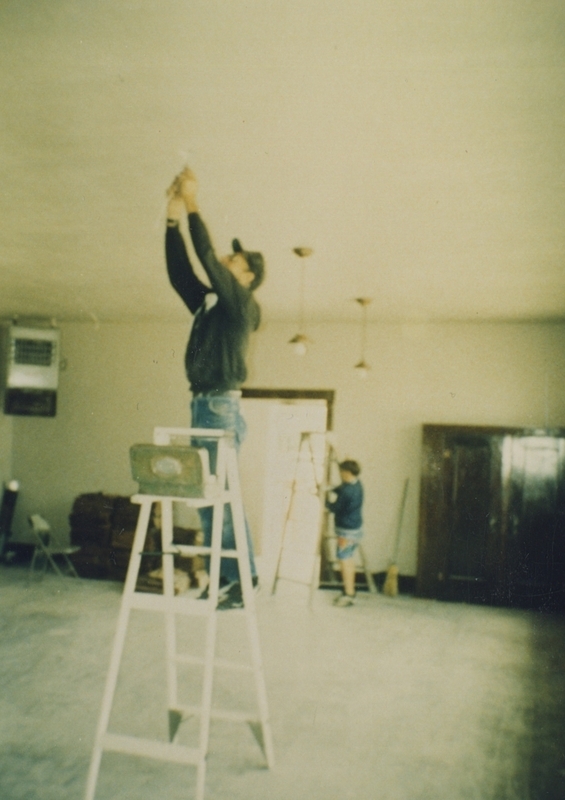 Mr. Zollinger and Grandson putting up lights, 1993