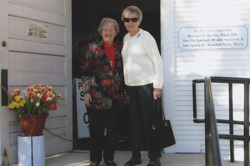 Fellow Meridian teachers Betty Kusler and Helen Bryce in front of the Pinse Street School on Rededication Day. 