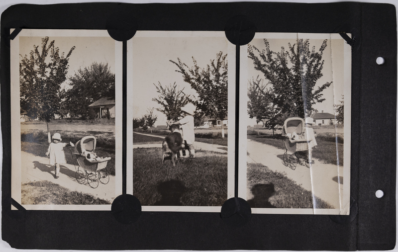 Mary Rice plays with doll stroller and dog.